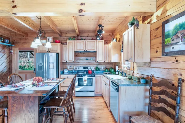a view of a dining table and chairs in a patio