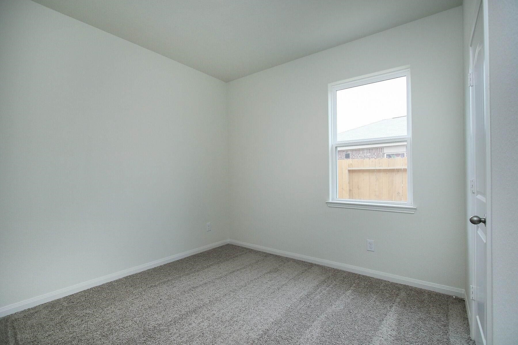 22422 Kennons Way Hockley, TX 77447 - Photo 8 of 11 an empty room with a window