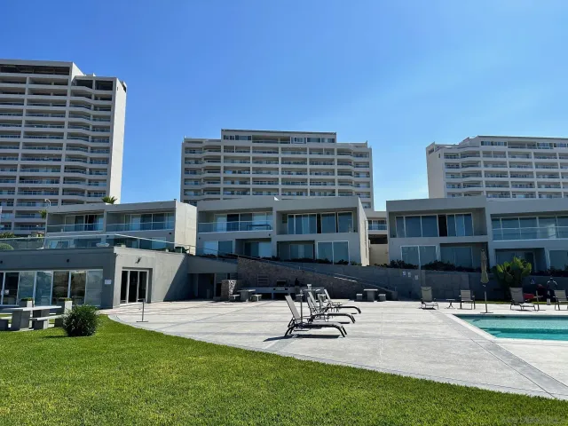 a large building with a yard in front of it