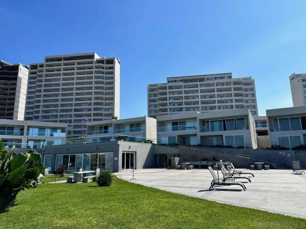 a terrace with outdoor seating and city view