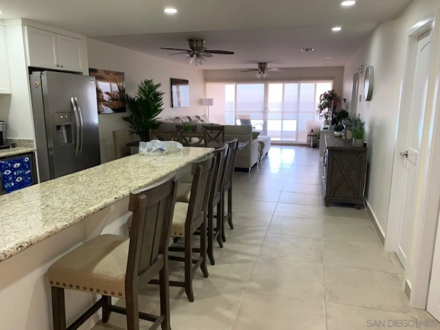 115 Carretera Libre Tijuana O'Neals, CA 93645 - Photo 19 of 62 a kitchen with stainless steel appliances kitchen island granite countertop furniture and a refrigerator
