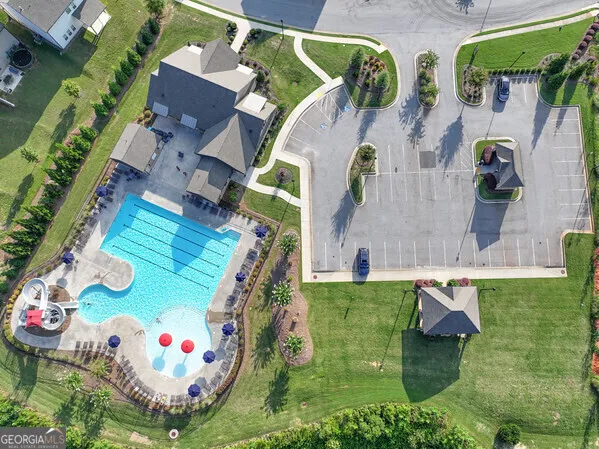 an aerial view of multiple houses with yard