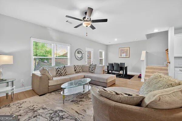 a living room with furniture and a window