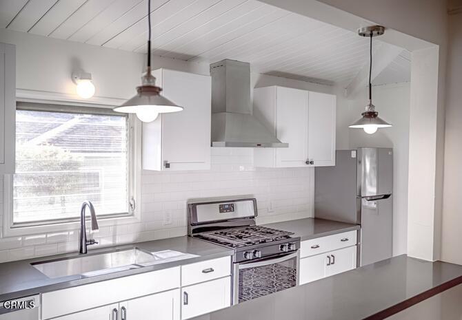 1416 Bath Street Santa Barbara, CA 93101 - Photo 4 of 15 a kitchen with stainless steel appliances granite countertop a sink a stove and a window