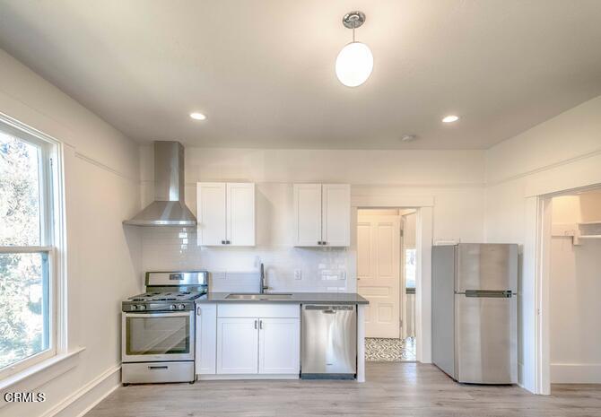 1416 Bath Street Santa Barbara, CA 93101 - Photo 6 of 15 a kitchen with a sink stainless steel appliances and window