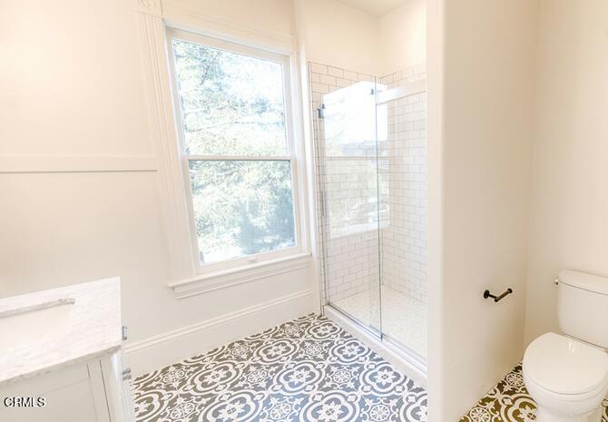 1416 Bath Street Santa Barbara, CA 93101 - Photo 7 of 15 a bathroom with a window and a shower