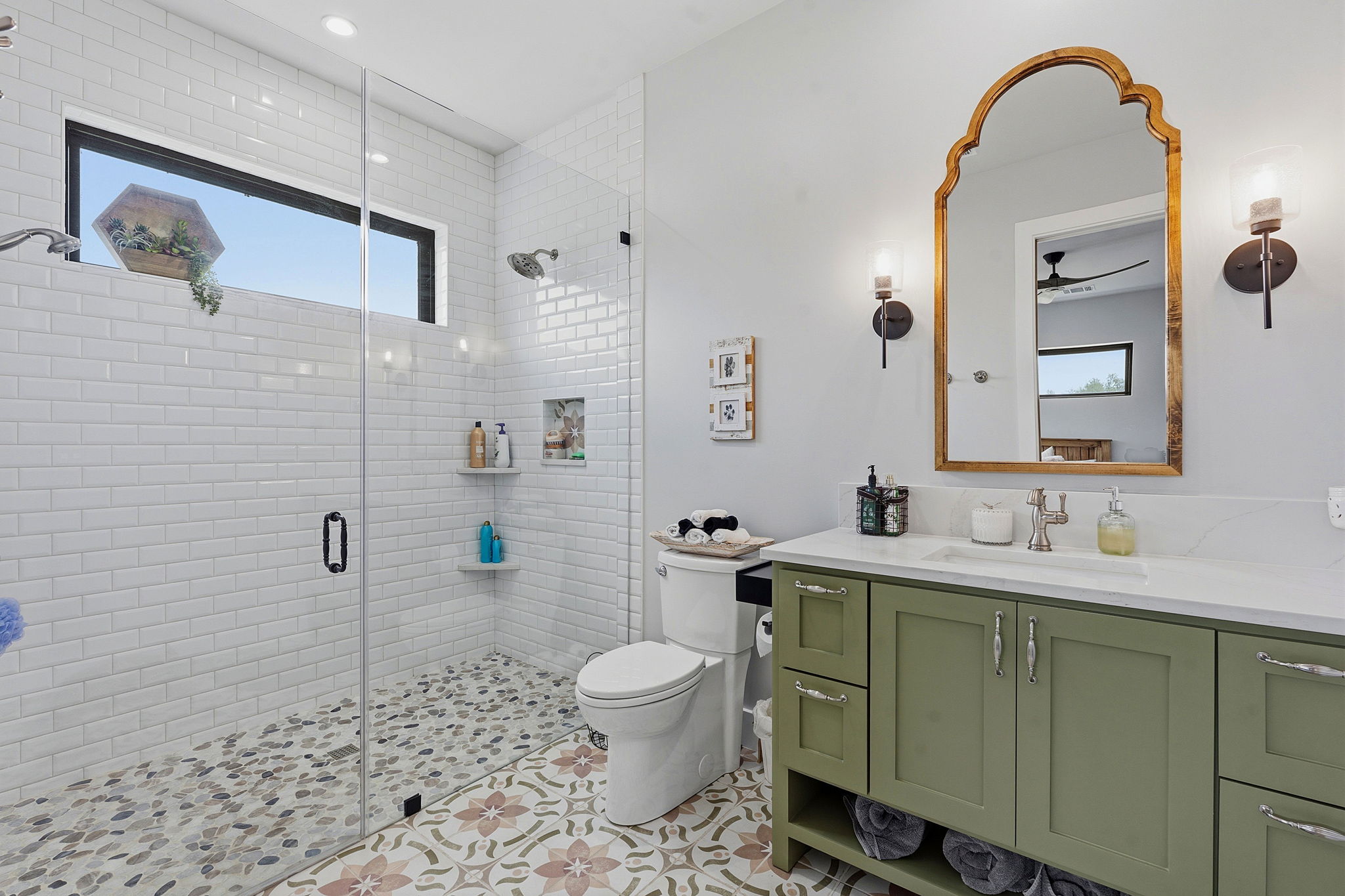 194 Placid Way Spring Branch, TX 78070 - Photo 23 of 37 Glass-enclosed shower with white subway tile surround, pebble tile floor, and integrated niche shelving