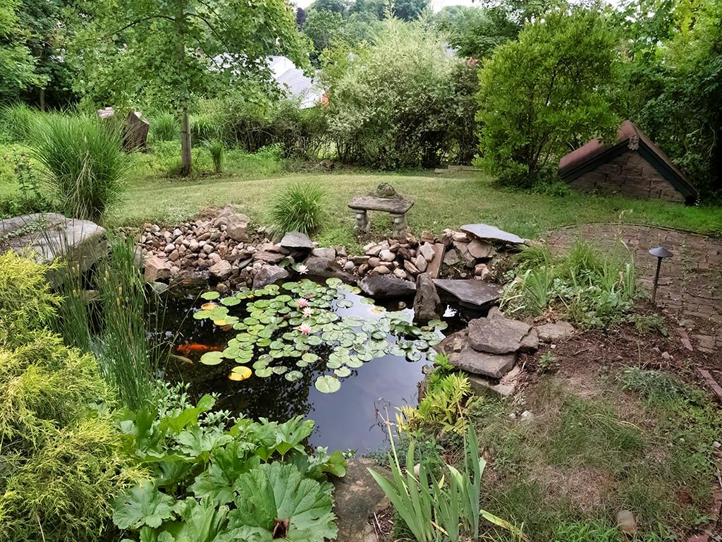1587 Anderson Road Pittsburgh, PA 15209 - Photo 19 of 22 a view of a garden with a lake