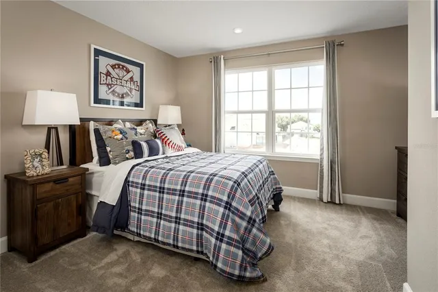 a bathroom with a toilet sink vanity and mirror