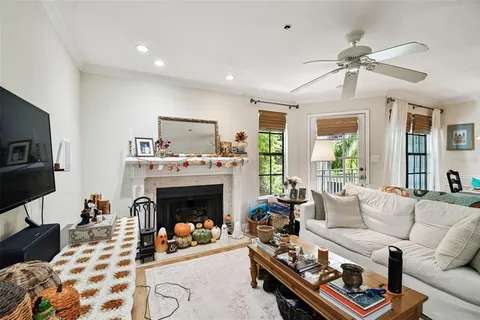 a living room with furniture and kitchen view