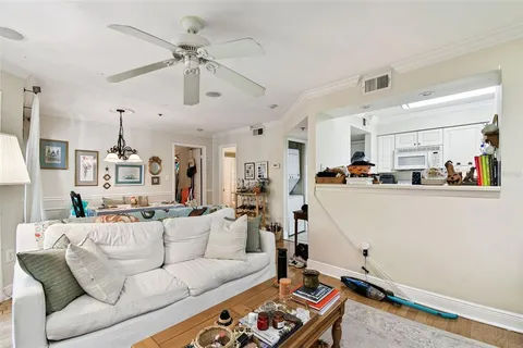 a view of walk in closet with clothes