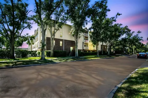 a view of living room with furniture and wooden floor