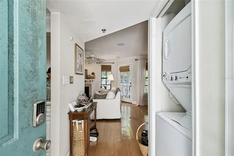 a living room with furniture a fireplace and wooden floor