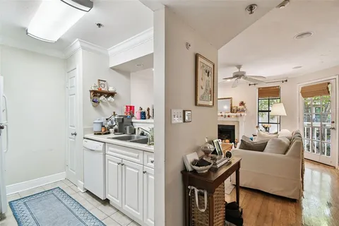 a kitchen with stainless steel appliances granite countertop a stove and a refrigerator