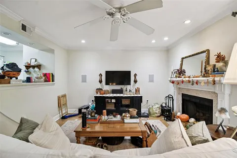 a living room with furniture fireplace and window