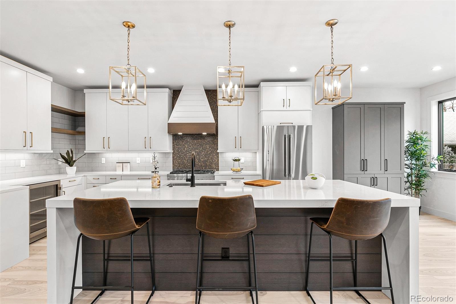 732 South Gilpin Street Denver, CO 80209 - Photo 18 of 40 a kitchen with a dining table chairs and white cabinets