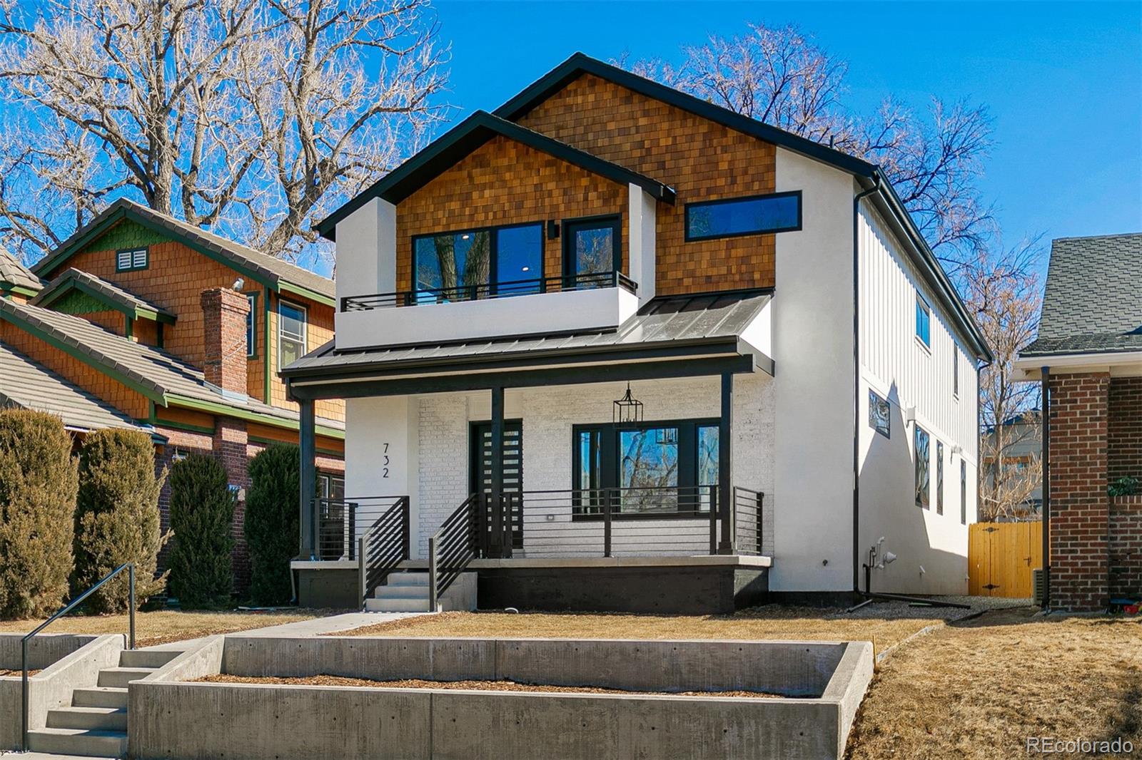 732 South Gilpin Street Denver, CO 80209 - Photo 2 of 40 a front view of a house with a porch