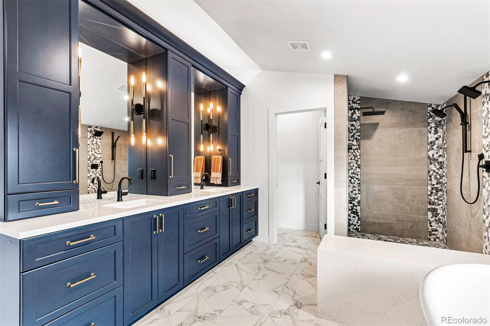 732 South Gilpin Street Denver, CO 80209 - Photo 27 of 40 a bathroom with a double vanity sink toilet and shower