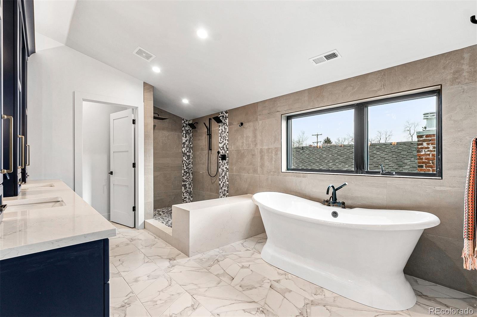 732 South Gilpin Street Denver, CO 80209 - Photo 29 of 40 a large white room with a large mirror and sink