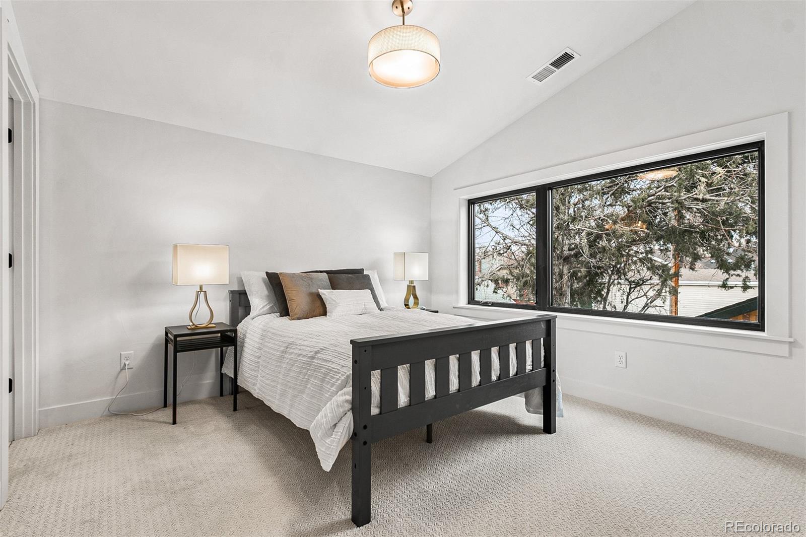 732 South Gilpin Street Denver, CO 80209 - Photo 32 of 40 a bedroom with a bed window and a night stand