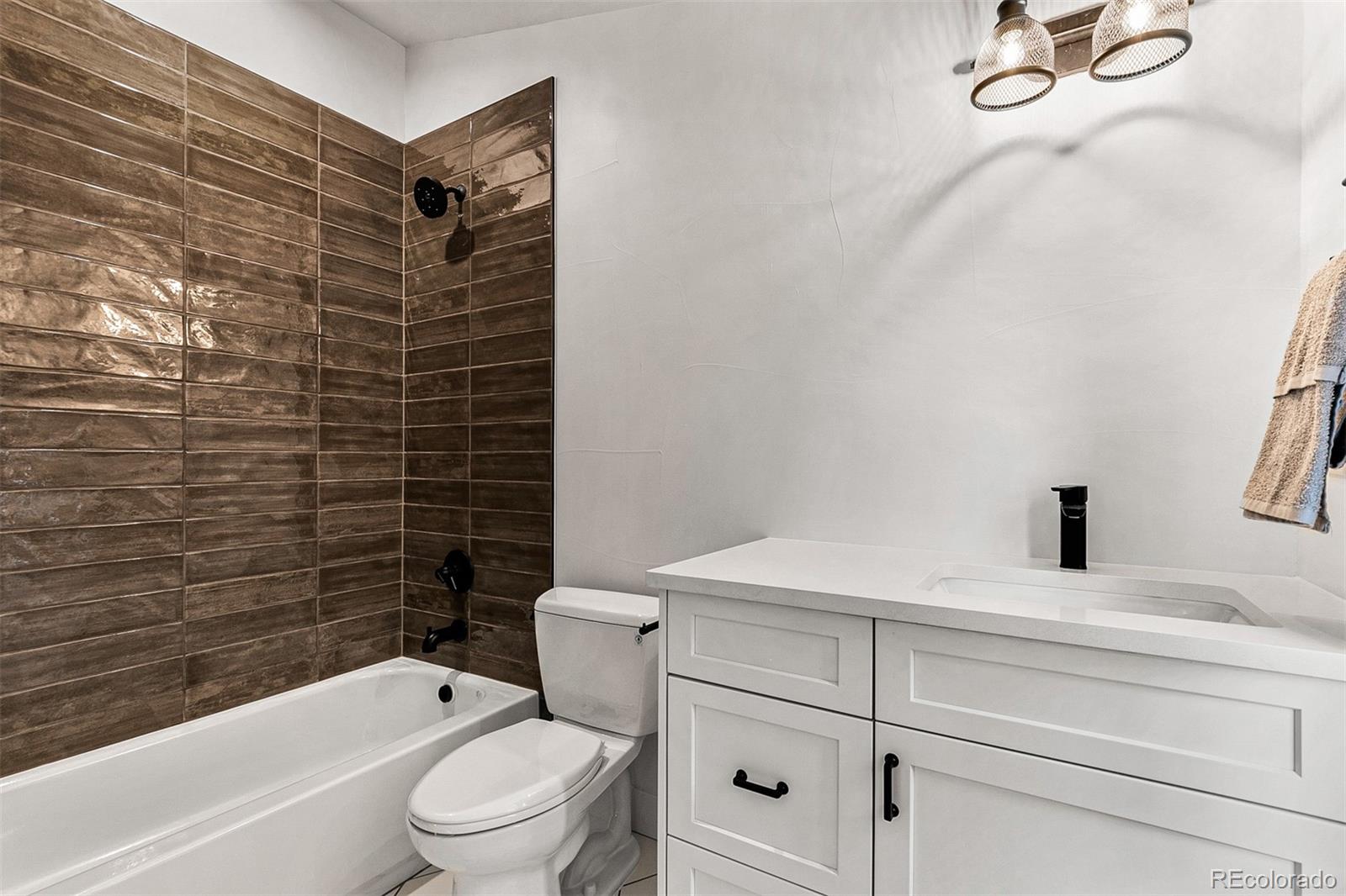 732 South Gilpin Street Denver, CO 80209 - Photo 33 of 40 a bathroom with a toilet and a bathtub