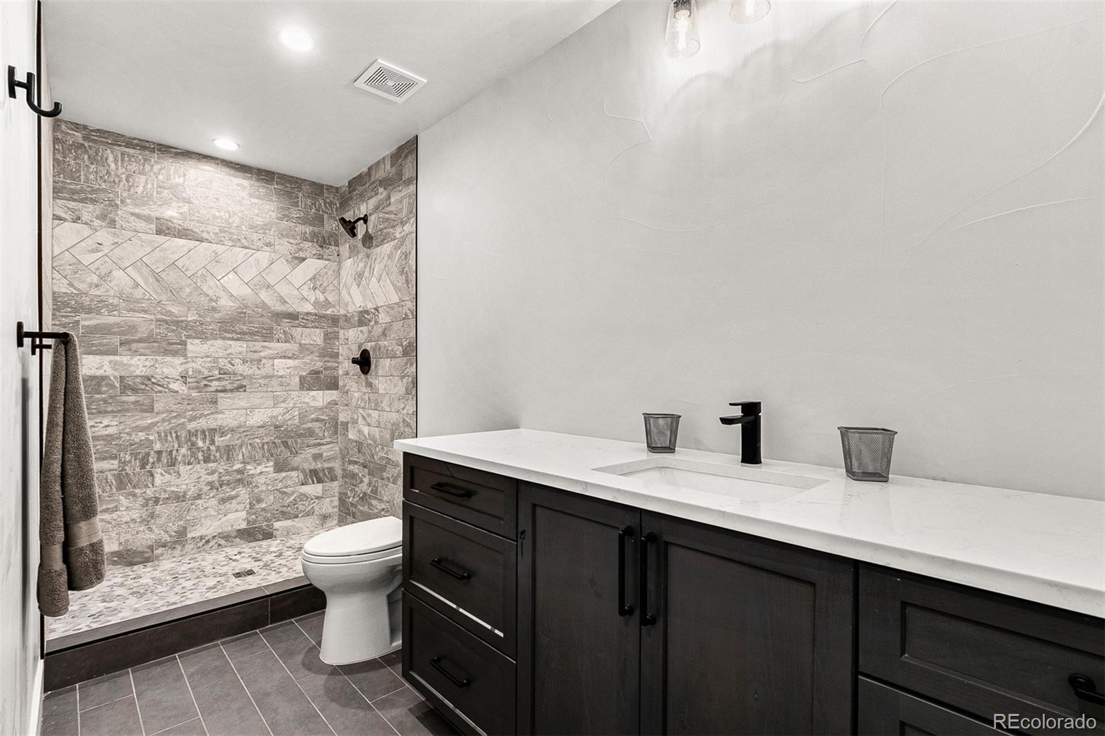 732 South Gilpin Street Denver, CO 80209 - Photo 35 of 40 a bathroom with a sink and a mirror