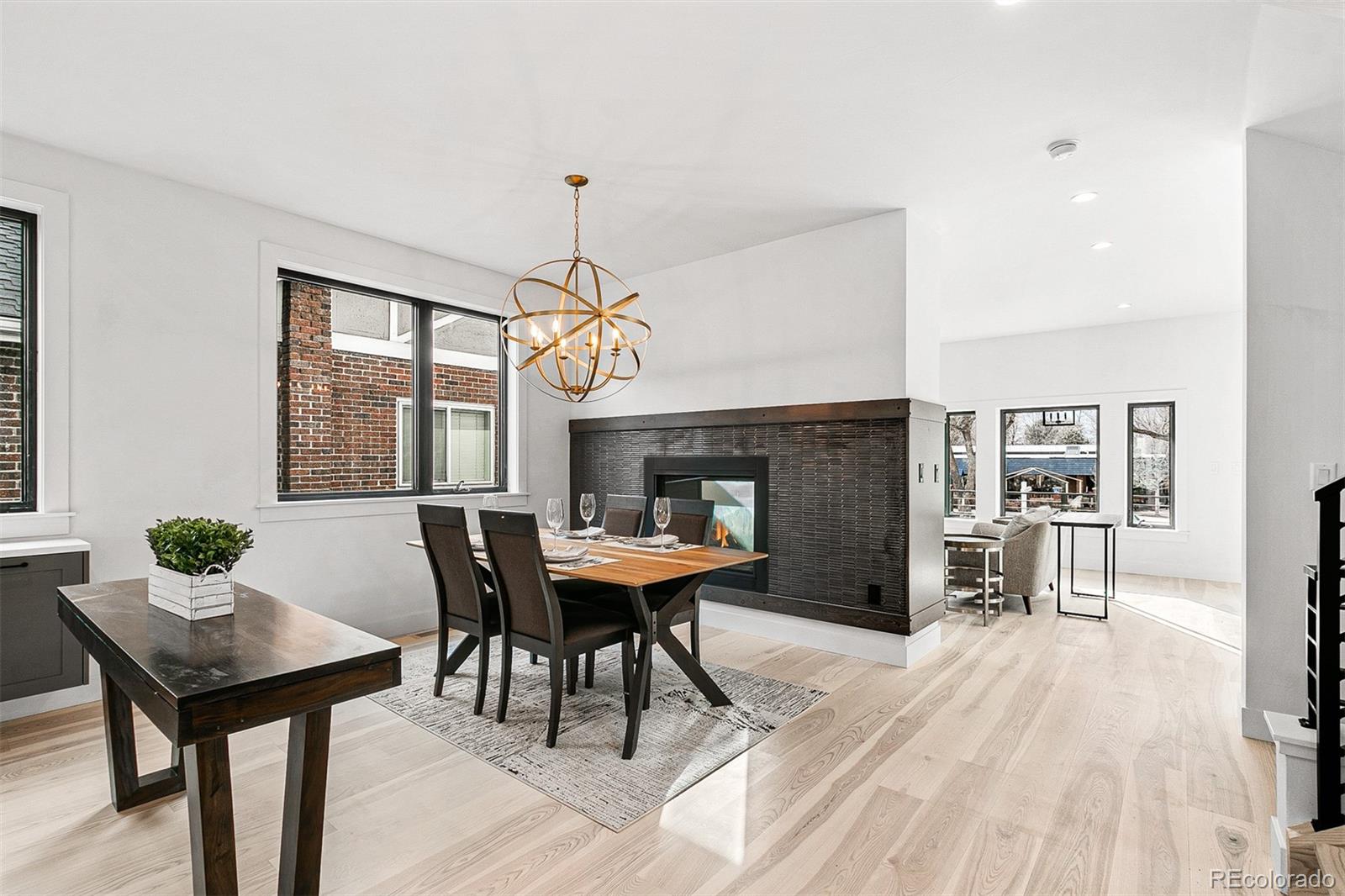 732 South Gilpin Street Denver, CO 80209 - Photo 9 of 40 a view of a dining room with furniture window and wooden floor