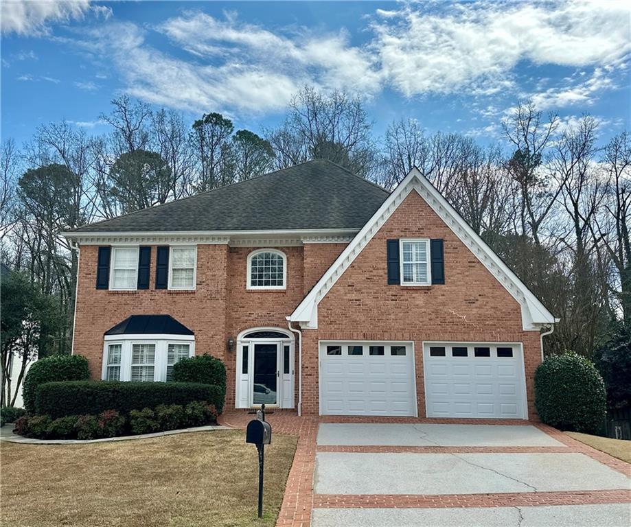 3510 Greystone Circle Atlanta, GA 30341 - Photo 1 of 29 a front view of a house with a yard and garage