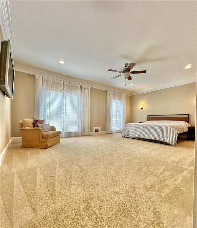 3510 Greystone Circle Atlanta, GA 30341 - Photo 14 of 29 a view of a bedroom with a large bed and a chandelier