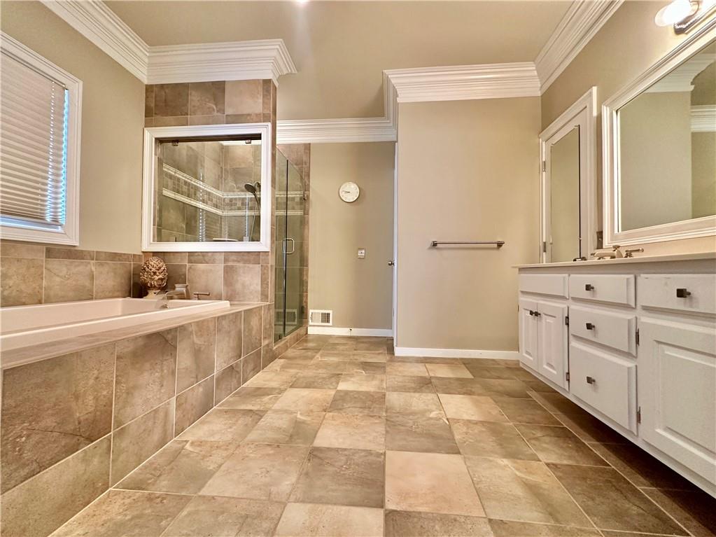 3510 Greystone Circle Atlanta, GA 30341 - Photo 15 of 29 a spacious bathroom with a granite countertop sink a mirror and a bathtub
