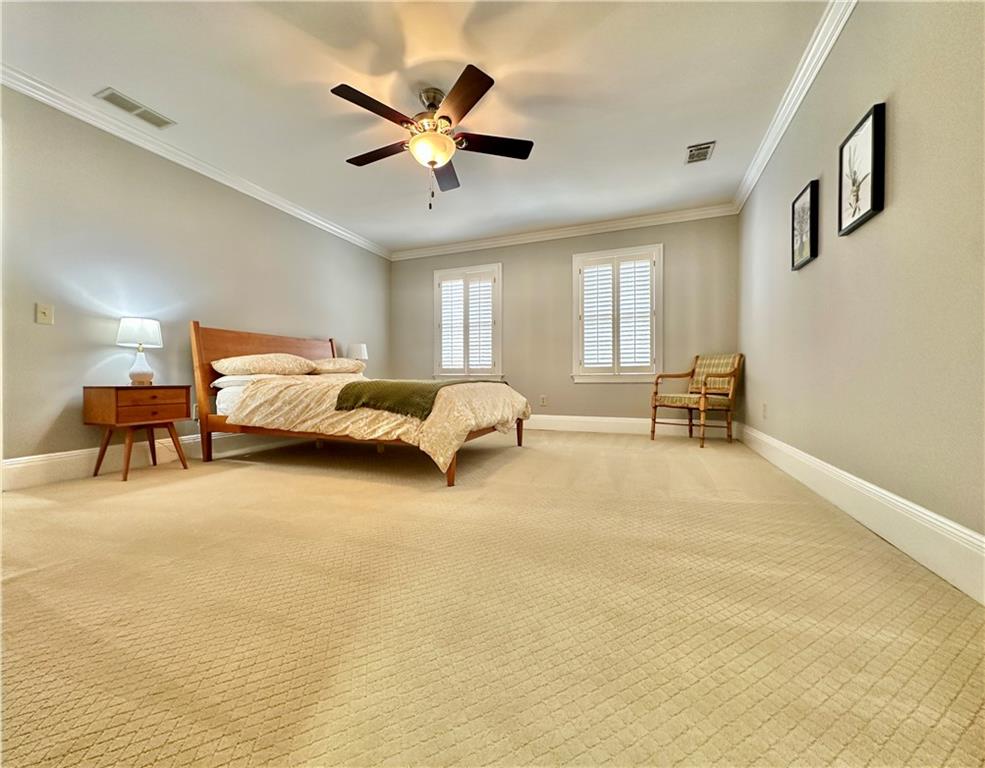 3510 Greystone Circle Atlanta, GA 30341 - Photo 18 of 29 a spacious bedroom with a bed and a chandelier