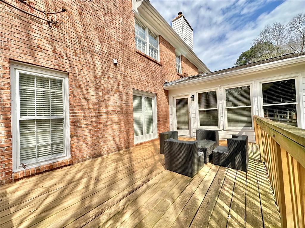 3510 Greystone Circle Atlanta, GA 30341 - Photo 24 of 29 a view of a deck with table and chairs
