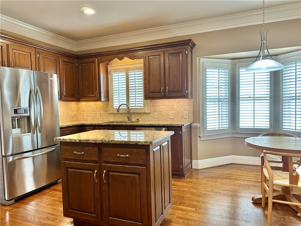 3510 Greystone Circle Atlanta, GA 30341 - Photo 9 of 29 a kitchen with granite countertop wooden floors and stainless steel appliances