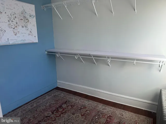 a view of a room with shelf on the wall