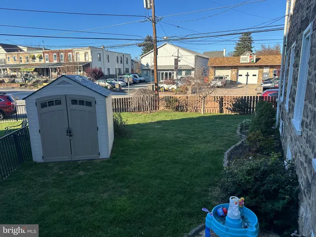 a view of a pathway with a backyard of the house
