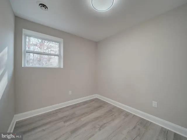 a bathroom with a bathtub and a toilet