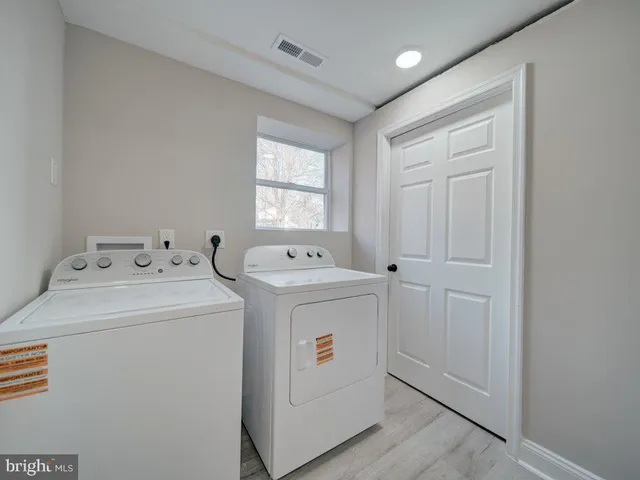 a view of a deck with wooden floor and fence