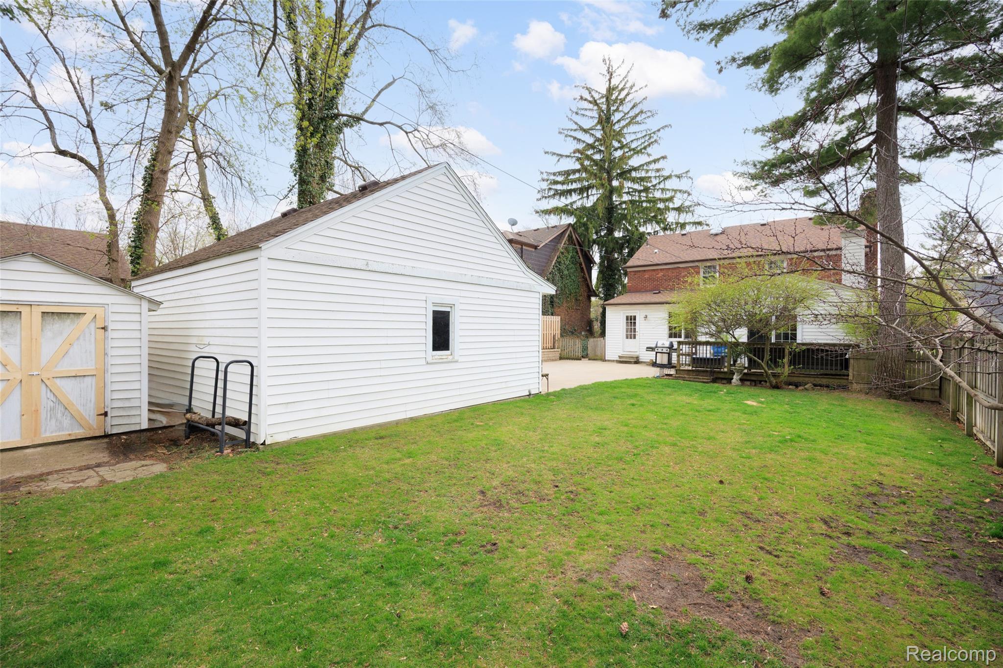 244 Kerby Road Grosse Pointe, MI 48236 - Photo 43 of 53 Fenced yard featuring a deck and a shed