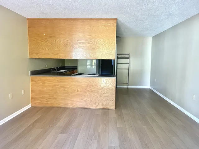 a view of kitchen and wooden floor