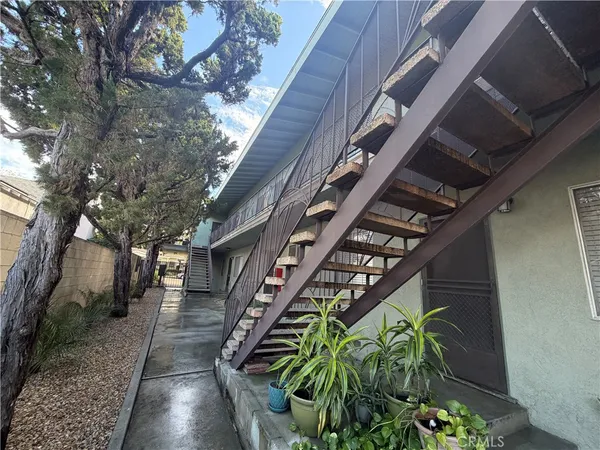 a backyard of a building with lots of green space