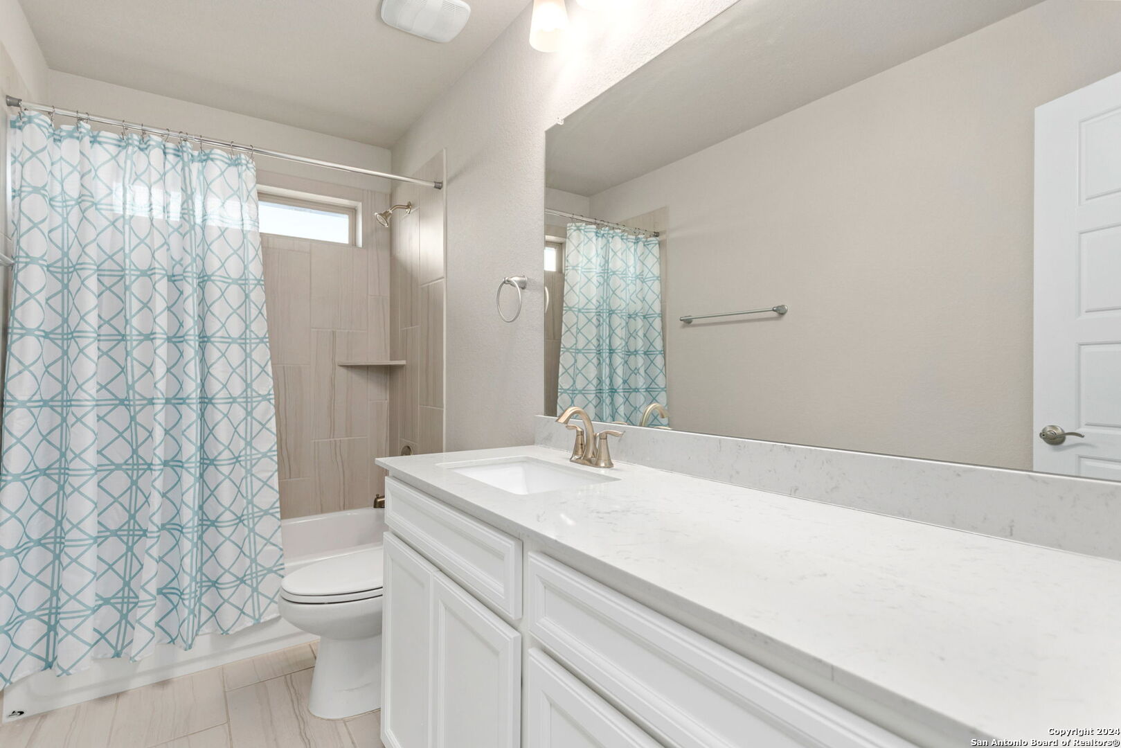 116 Escondido Boerne, TX 78006 - Photo 12 of 16 a bathroom with a sink a toilet a mirror and shower
