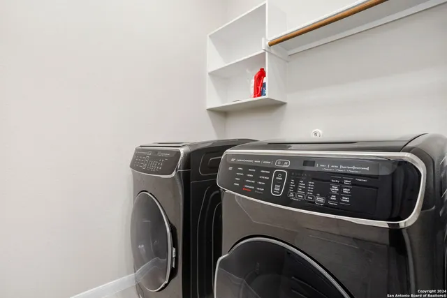 a utility room with dryer and washer