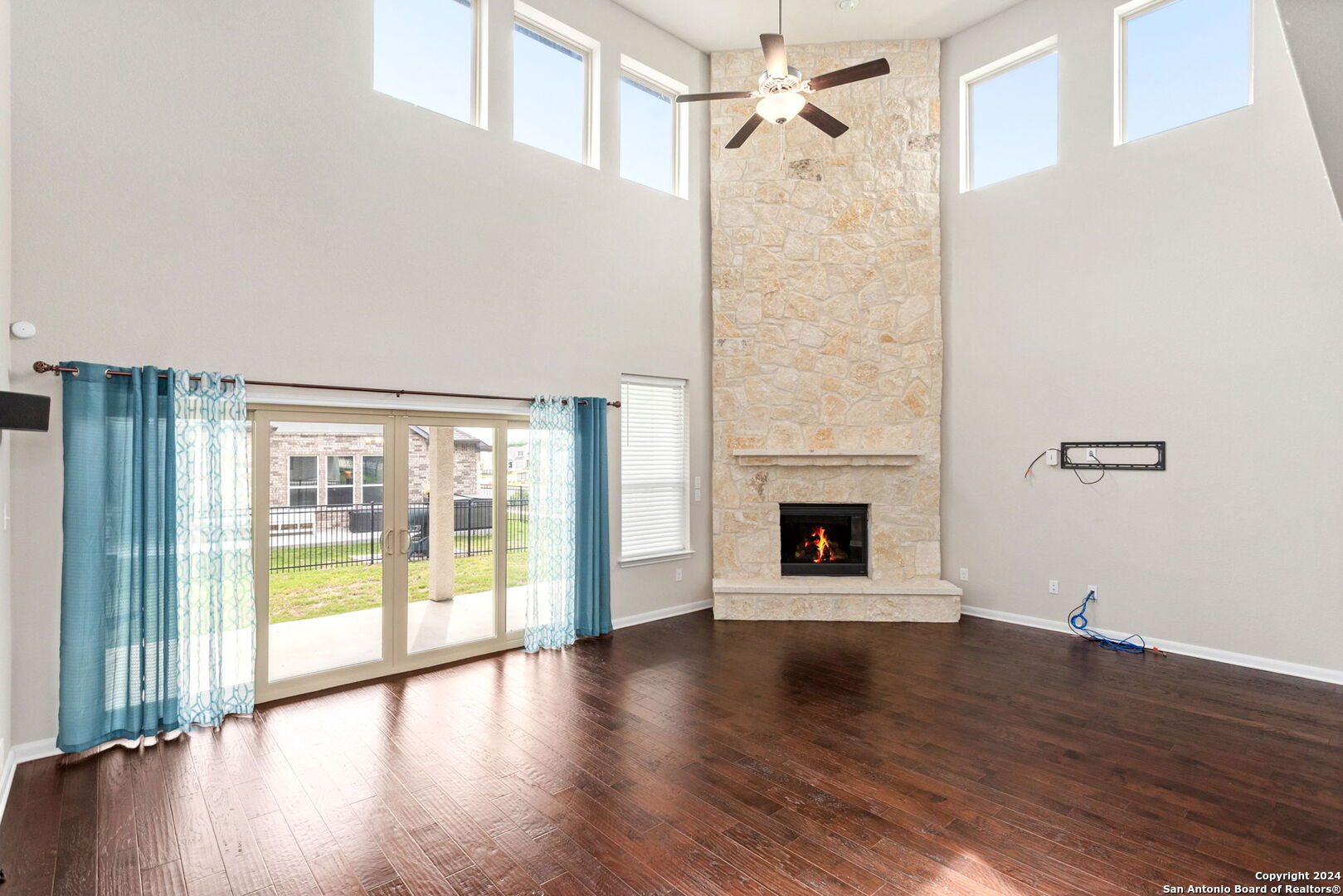 116 Escondido Boerne, TX 78006 - Photo 4 of 16 a view of a livingroom with wooden floor and a fireplace