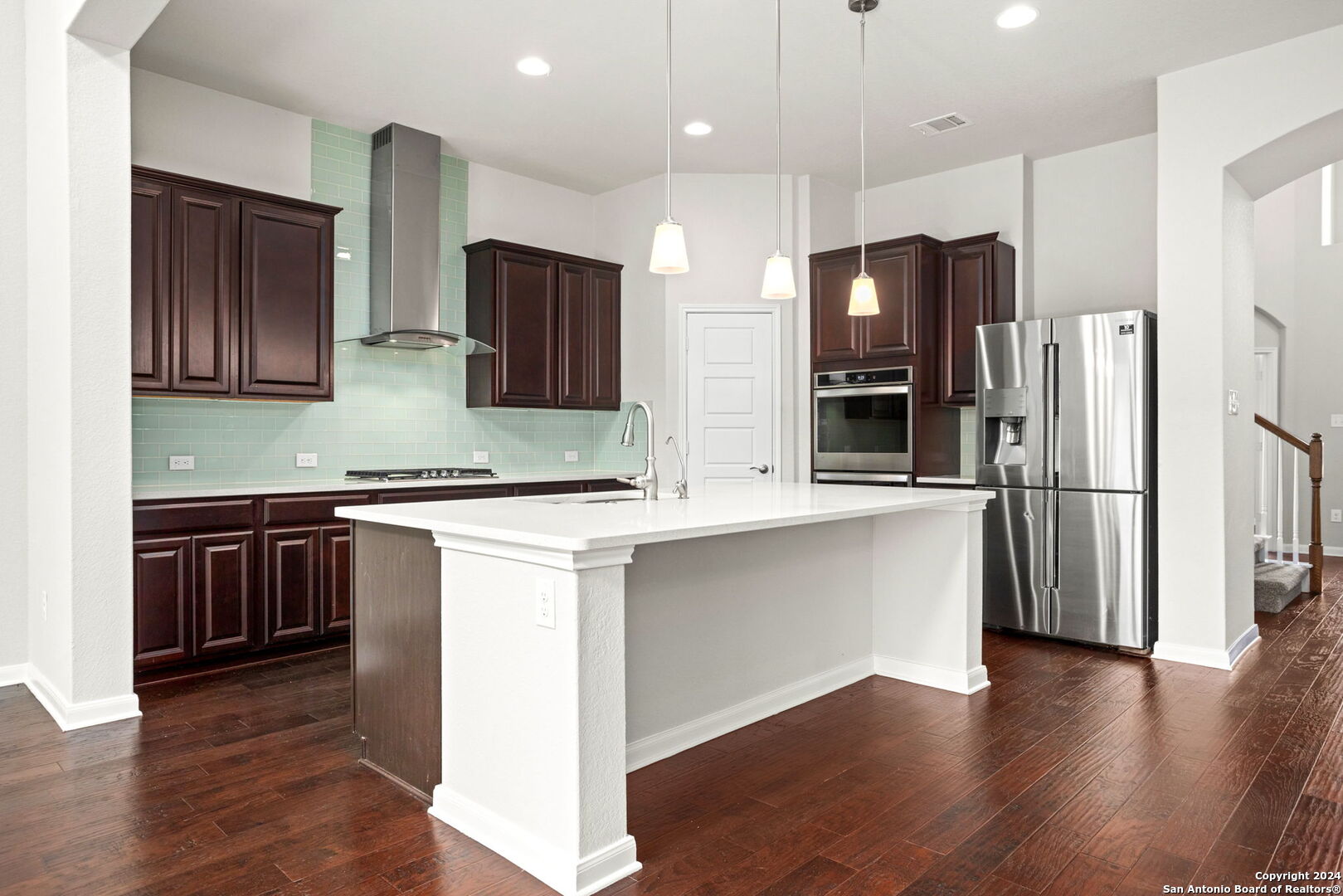 116 Escondido Boerne, TX 78006 - Photo 5 of 16 a kitchen with stainless steel appliances granite countertop a refrigerator and a stove top oven