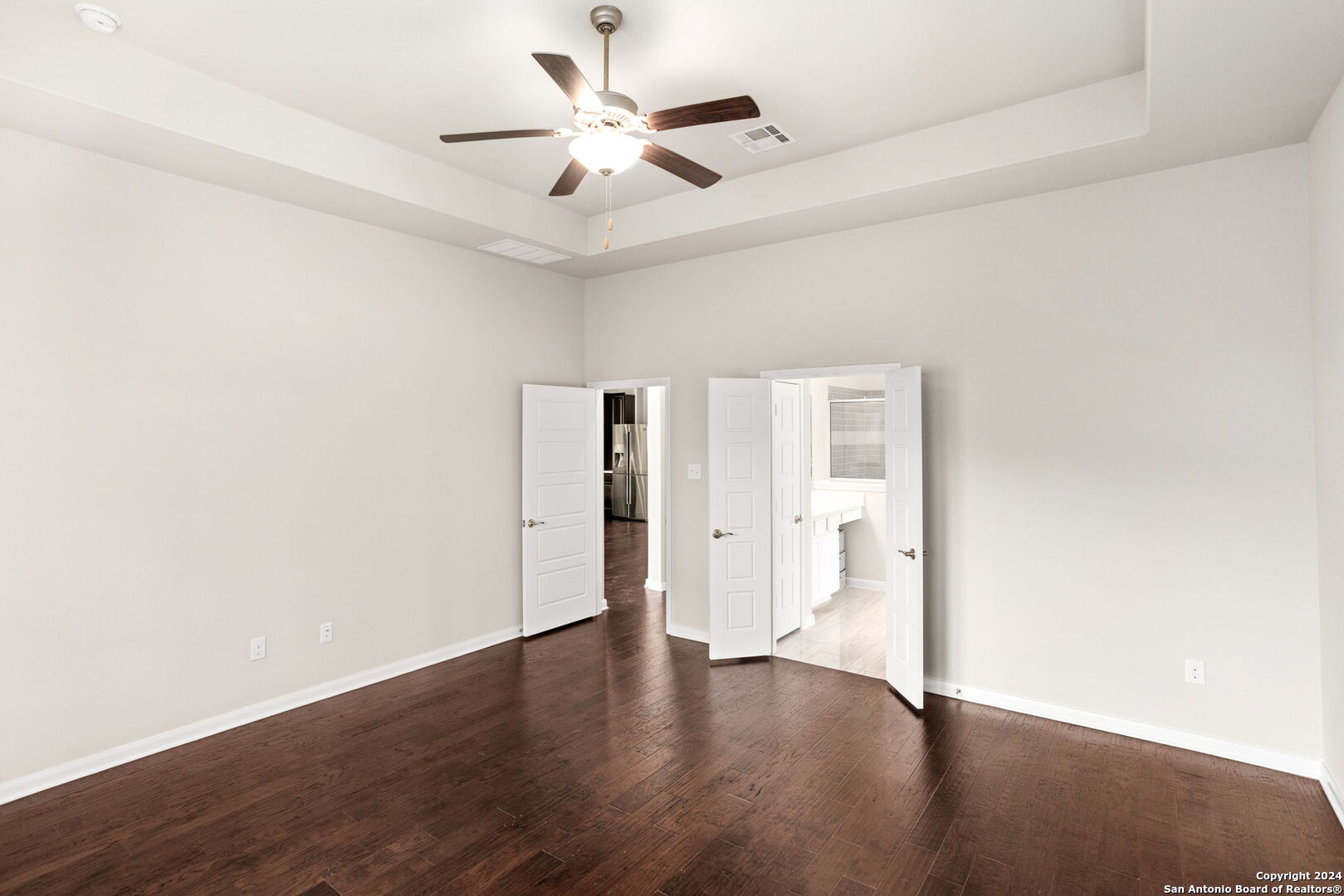 116 Escondido Boerne, TX 78006 - Photo 9 of 16 an empty room with wooden floor and ceiling fan