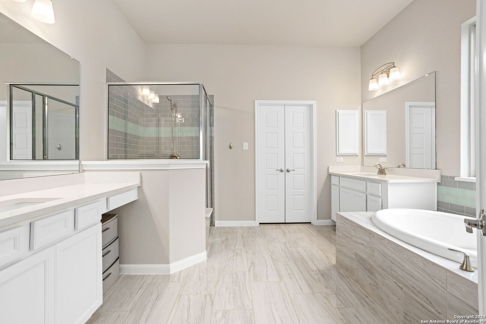 116 Escondido Boerne, TX 78006 - Photo 10 of 16 a spacious bathroom with a double vanity sink a mirror and a shower