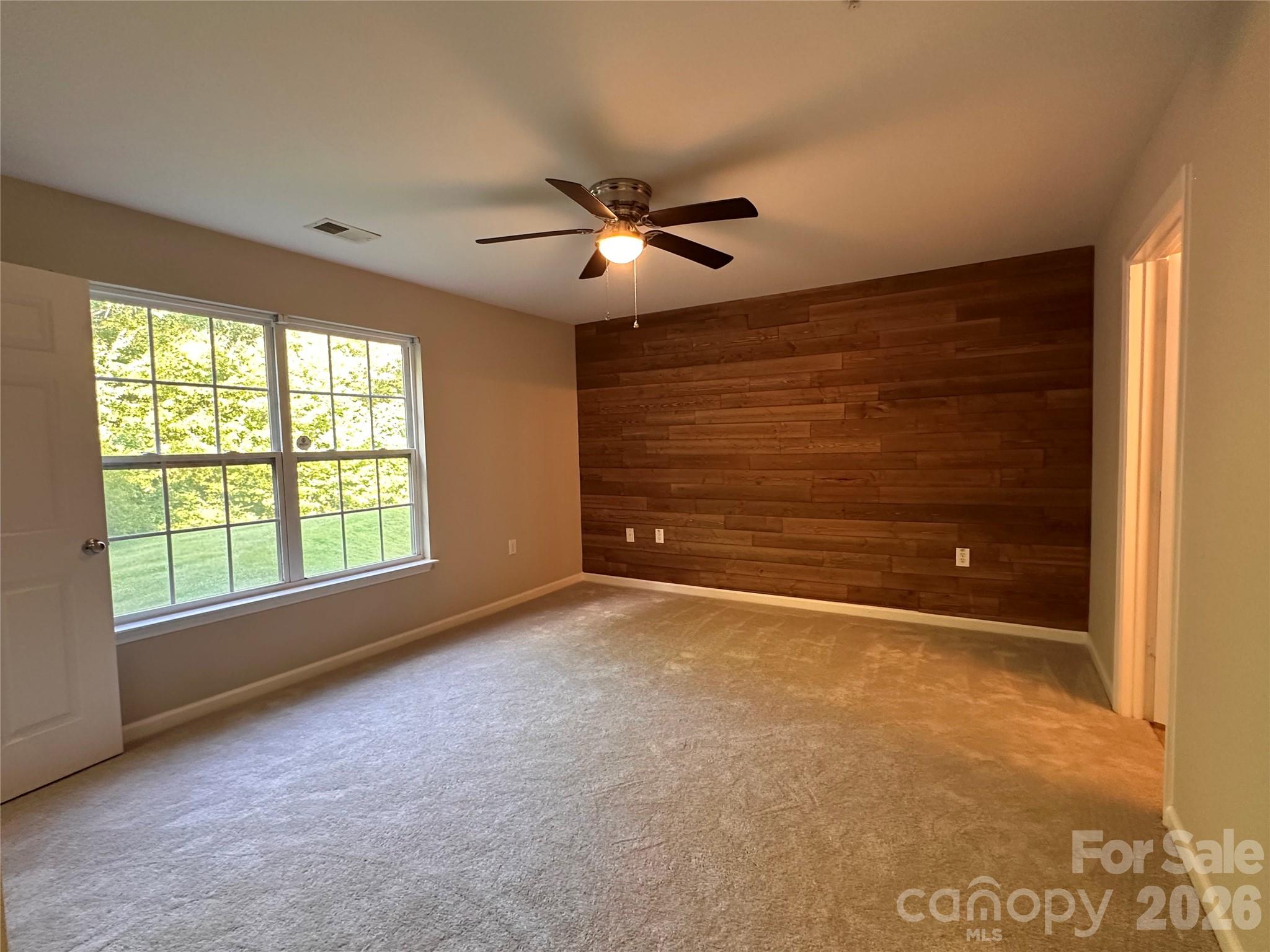 5236 Hilltop Road Jamestown, NC 27282 - Photo 19 of 32 a view of an empty room with a window