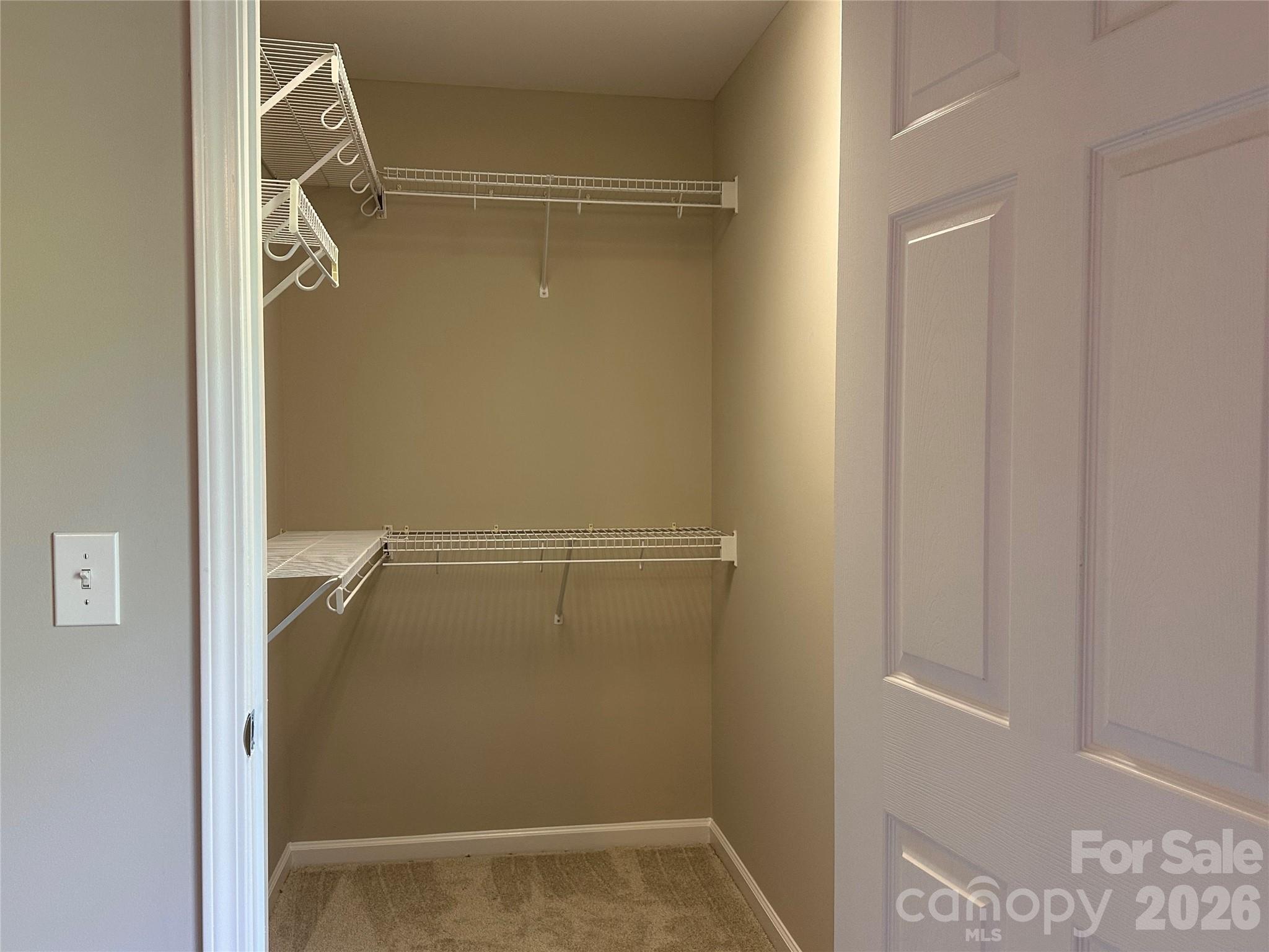 5236 Hilltop Road Jamestown, NC 27282 - Photo 20 of 32 a view of walk in closet with empty racks
