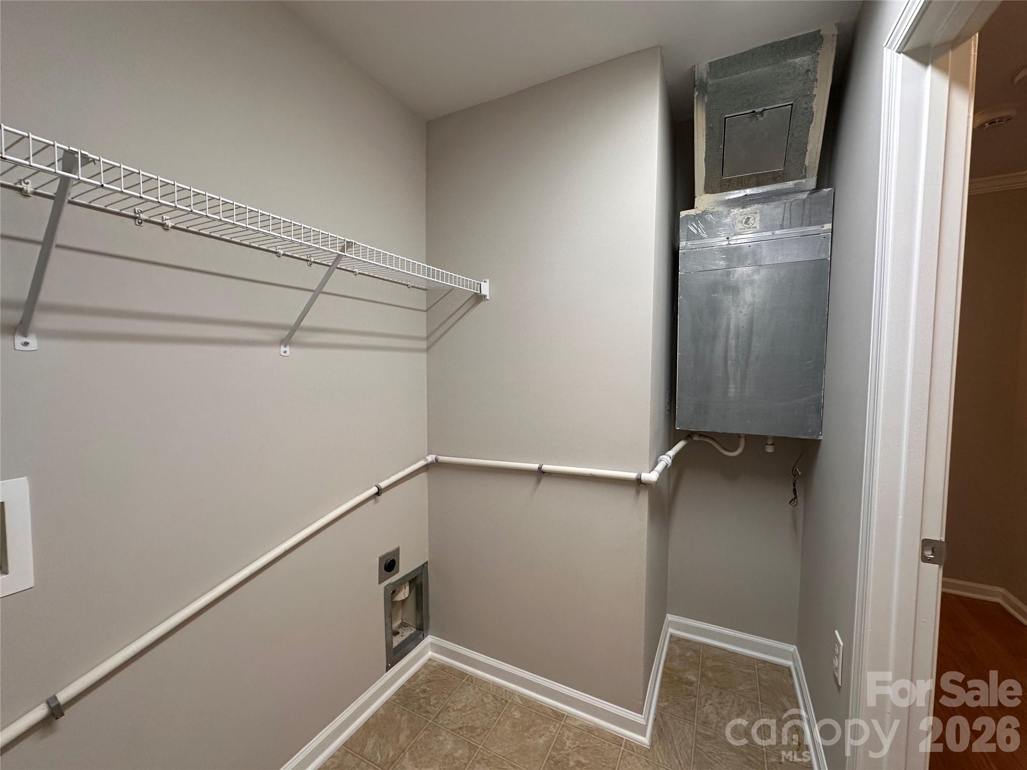 5236 Hilltop Road Jamestown, NC 27282 - Photo 29 of 32 a view of walk in closet with empty racks