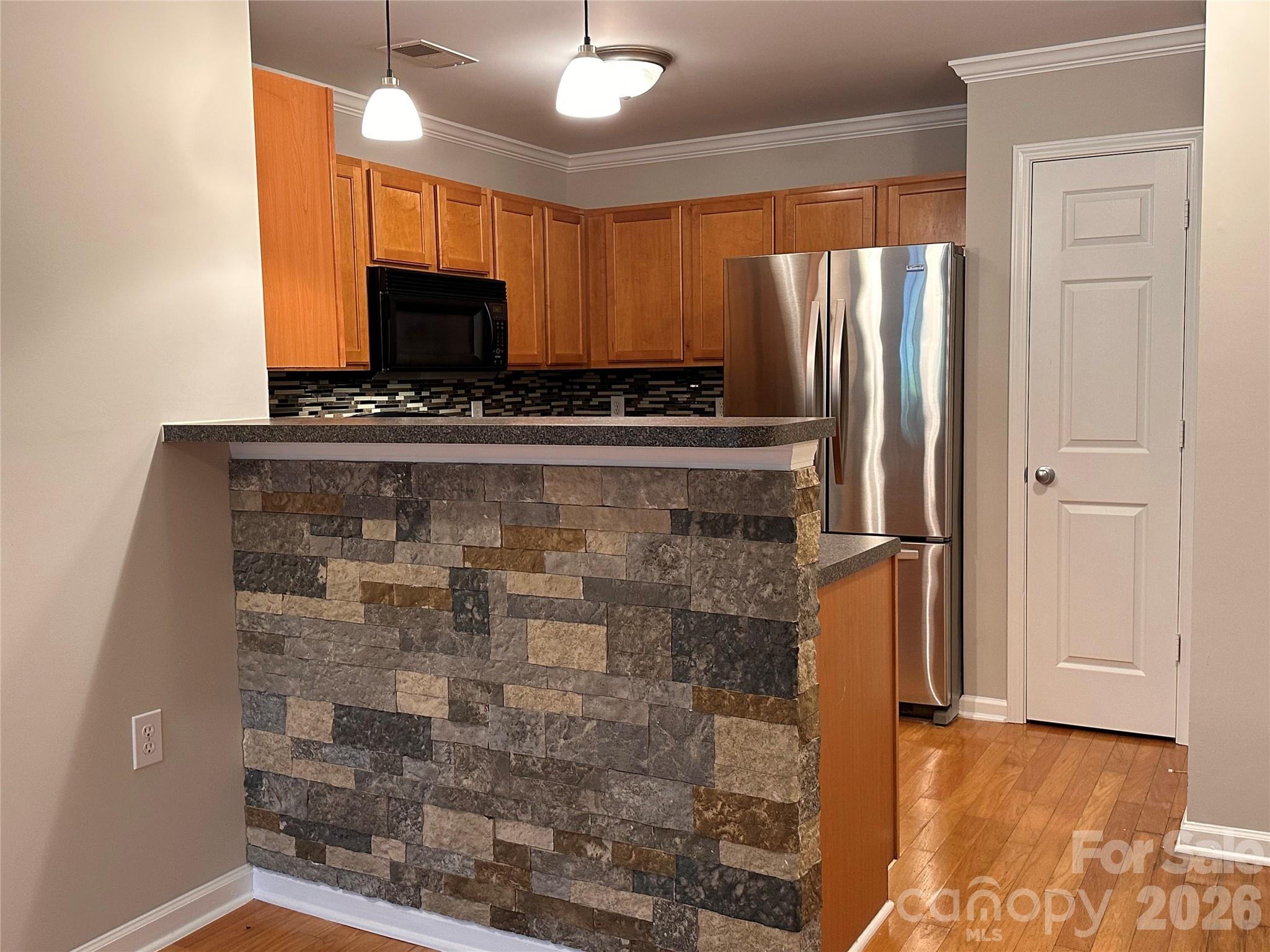 5236 Hilltop Road Jamestown, NC 27282 - Photo 7 of 32 a view of a refrigerator in the kitchen
